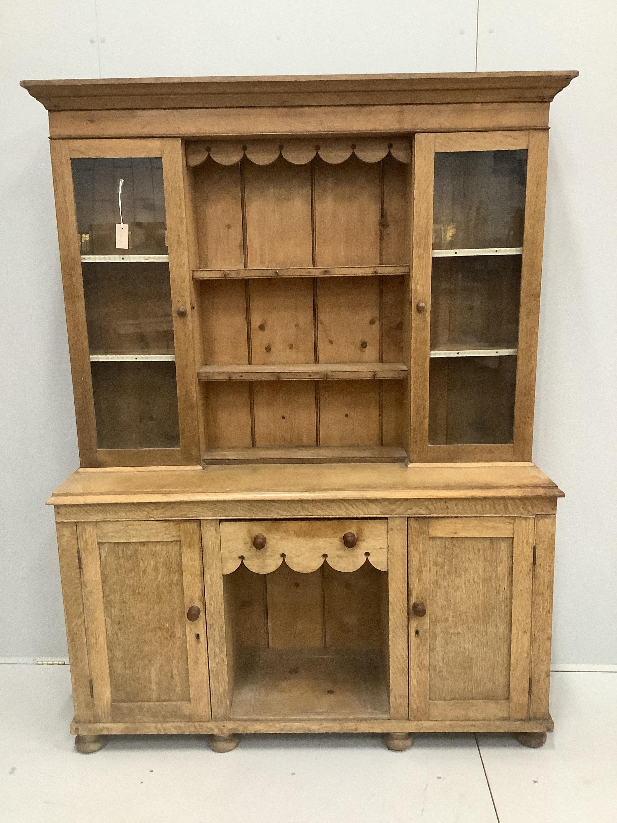 A late Victorian pale oak dresser, width 151cm, depth 44cm, height 202cm